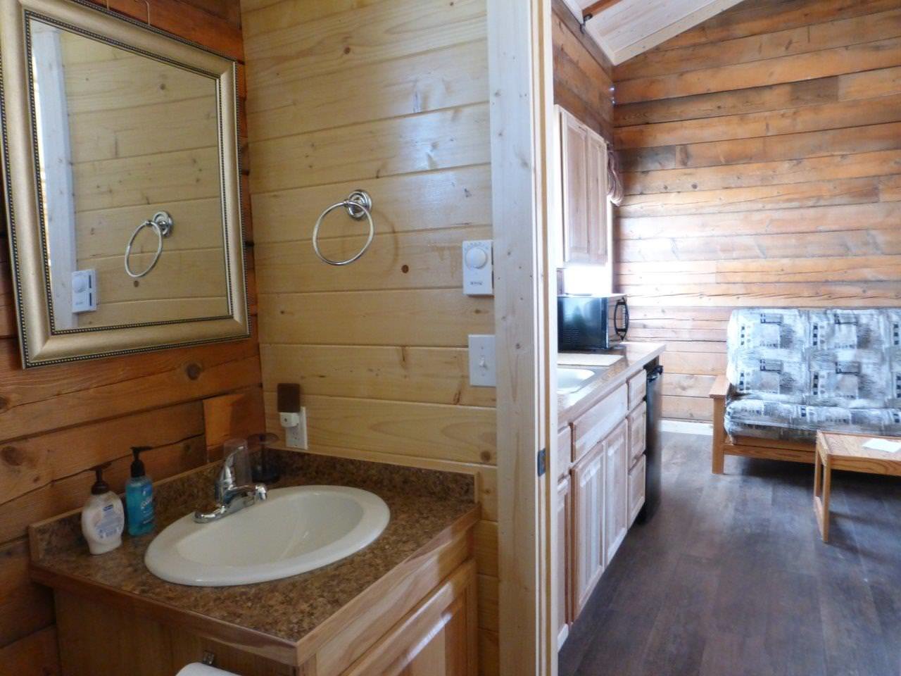 Inside Sperry cabin with washroom and kitchen.
