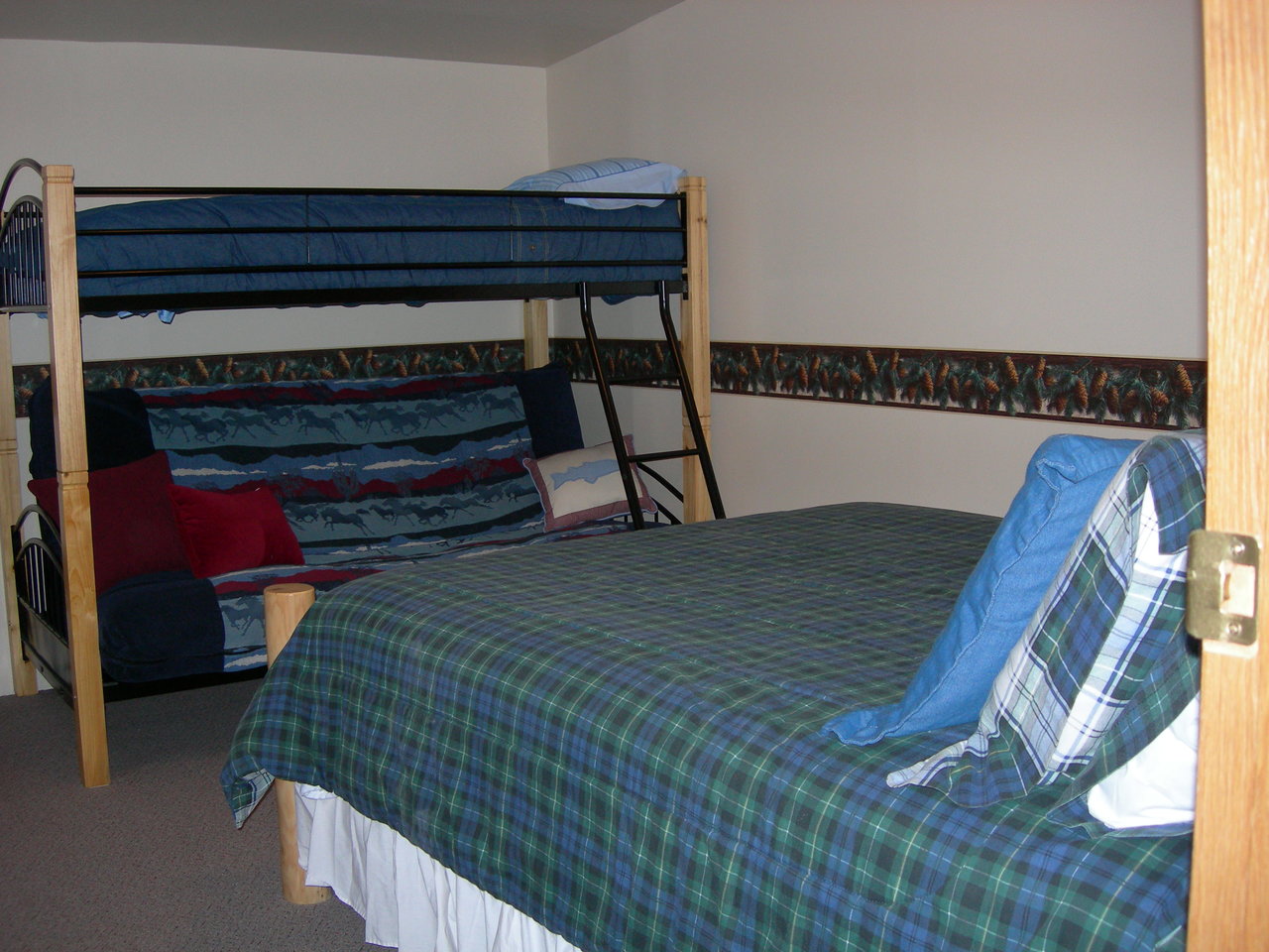 Glacier cabin sleeping area, with bunk and bed.