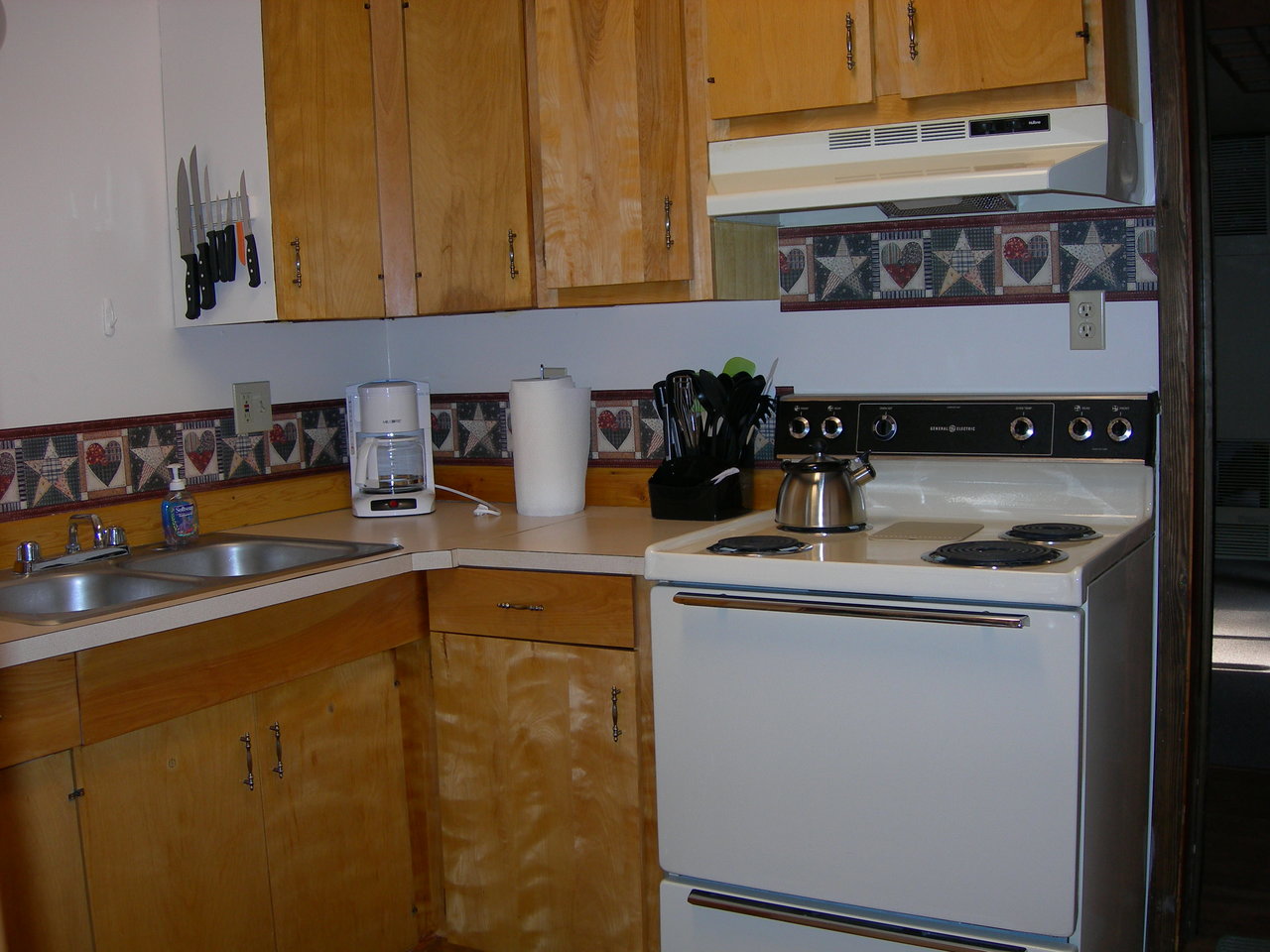 Glacier cabin kitchen area with appliances.